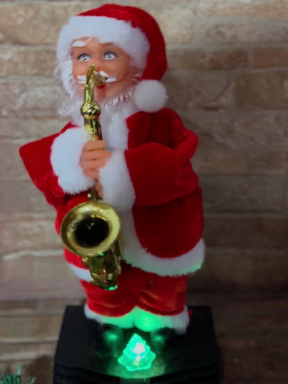 Papa Noel Saxofonista Luces, Sonido y Movimiento de 25 cm - 50% OFF y Envío gratis